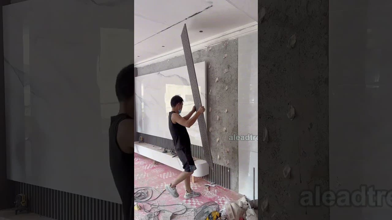 Sintered stone TV background wall installation #interiordesign #walldesign