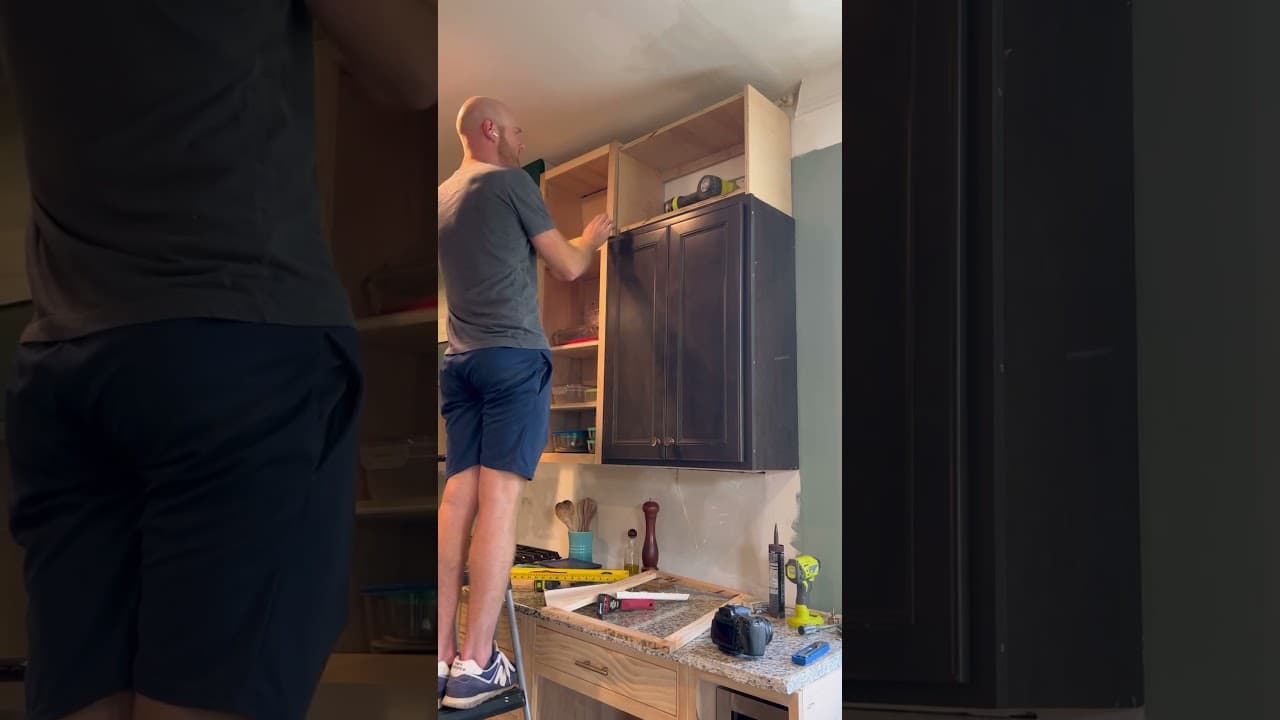 Installing the upper upper cabinets of our #kitchenrenovation. #diyhome #kitchenremodel